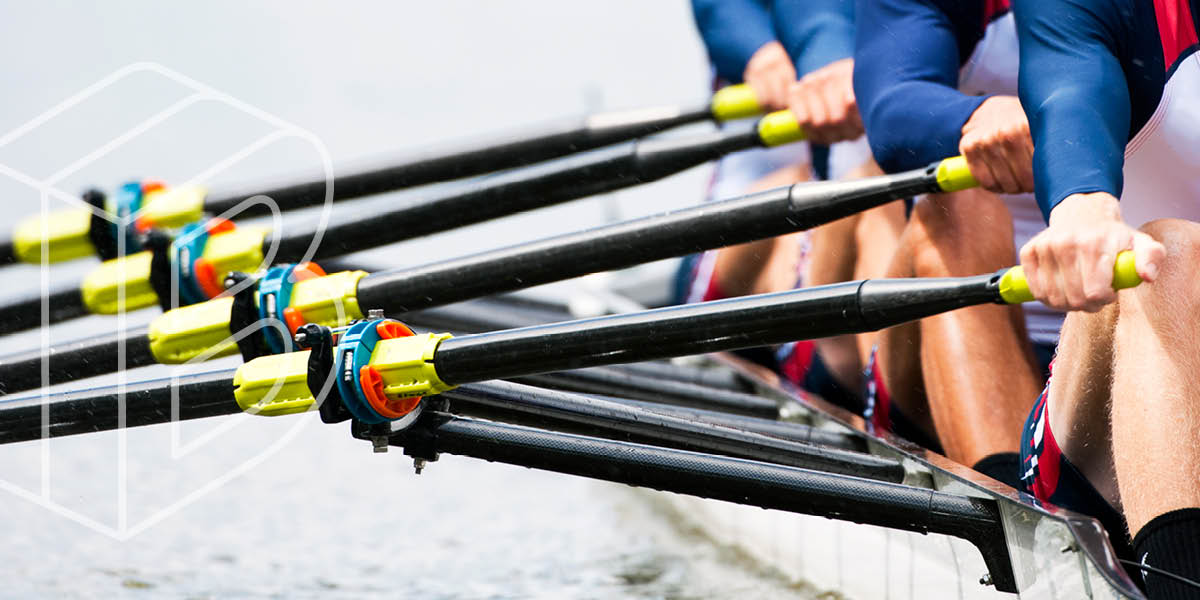 Banner Image of rowers in a boat, close-up on the oars