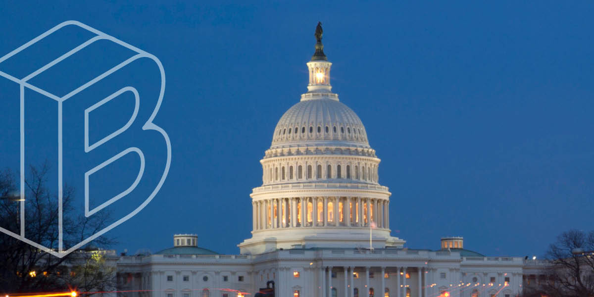 Photo of the US Capitol Building lit up at night