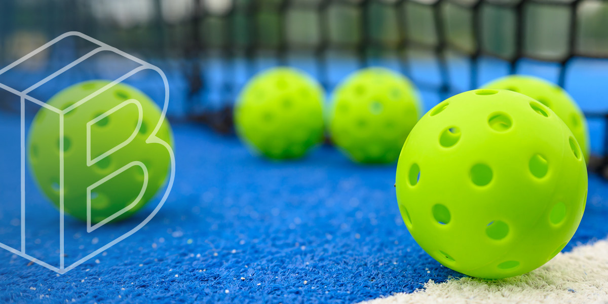 Banner image: green pickleballs on a blue ground