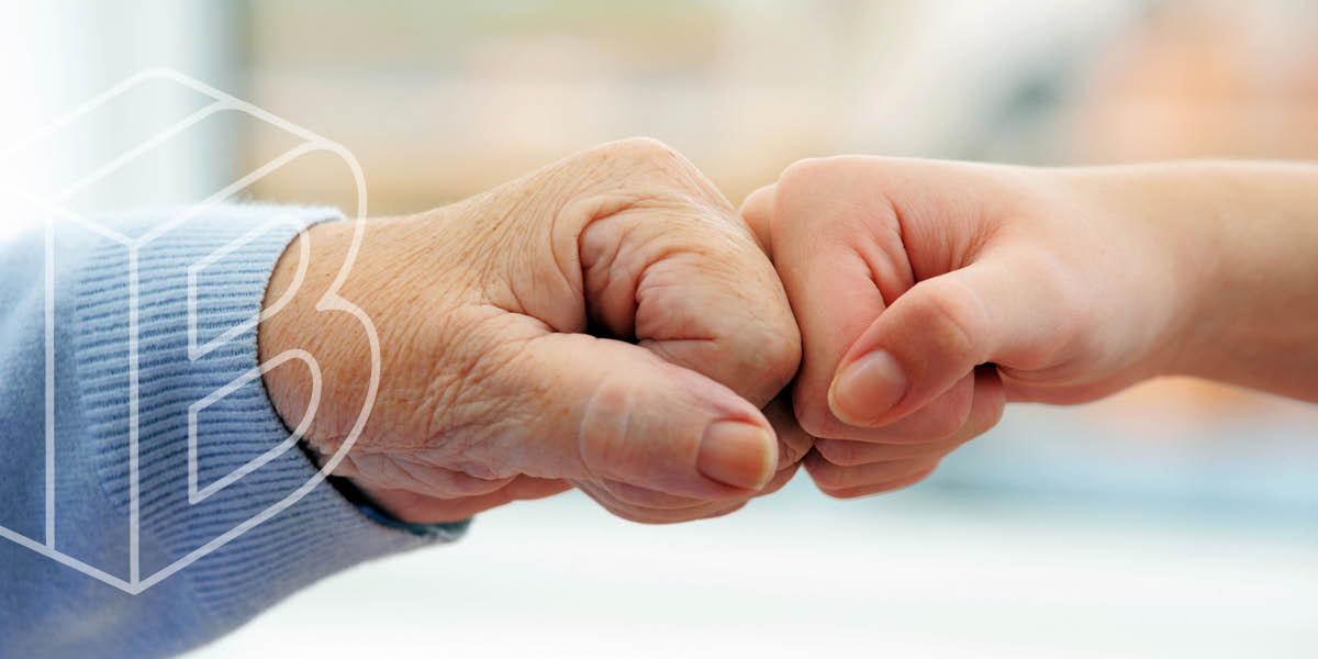 Banner image of two fists bumping