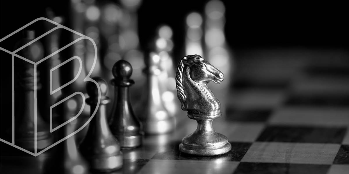 Banner image: black and white chess board with the knight piece moved forward